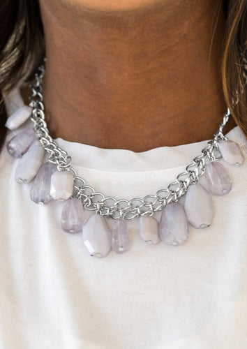 Featuring asymmetrical cuts, cloudy and polished gray beads swing from the bottom of interlocking silver chains. The faceted beads drip below the collar, adding a shimmery edge to the effervescent fringe. Features an adjustable clasp closure.  Sold as one individual necklace. Includes one pair of matching earrings.