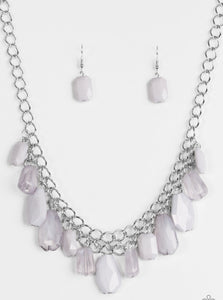 Featuring asymmetrical cuts, cloudy and polished gray beads swing from the bottom of interlocking silver chains. The faceted beads drip below the collar, adding a shimmery edge to the effervescent fringe. Features an adjustable clasp closure.  Sold as one individual necklace. Includes one pair of matching earrings.
