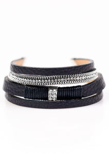 Brushed in a glistening finish, shimmery dark blue leather strands layer across the wrist in a colorful urban fashion. Strands of shimmery silver chain and dazzling white rhinestones adorn leather strands for a glamorous finish. Features an adjustable clasp closure.  Sold as one individual bracelet.