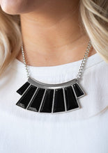 Load image into Gallery viewer, Faceted black emerald style beads are pressed into a hammered silver plate. Featuring flared bottoms, the bold beads fan out below the collar for a fierce finish. Features an adjustable clasp closure.  Sold as one individual necklace. Includes one pair of matching earrings.