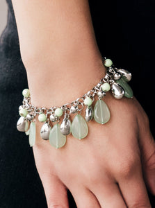 Refreshing Spearmint and glistening silver teardrops swing from a bold silver chain. Matching Spearmint and silver beads trickle between the teardrops, creating a flirty fringe around the wrist