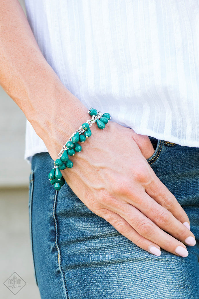 Featuring round and teardrop shapes, clusters of faceted Quetzal Green beads swing from a shimmery silver chain, creating a playful fringe around the wrist. Features an adjustable clasp closure.  Sold as one individual bracelet.   Glimpses of Malibu Fashion Fix September 2018  Always nickel and lead free.