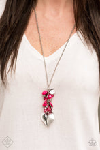 Load image into Gallery viewer,  Infused with an array of pink beads, a collection of antiqued silver shell and butterfly charms trickle along the bottom of a shimmery silver chain. Complemented with a glittery white rhinestone encrusted bead, a dramatically oversized silver heart pendant swings from the bottom of the clustered tassel for a whimsical finish. Features an adjustable clasp closure