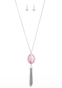 An oversized pink cat's eye stone frame gives way to a shimmery silver chain tassel, creating a whimsically stacked pendant at the bottom of a lengthened silver chain. Features an adjustable clasp closure.  Sold as one individual necklace. Includes one pair of matching earrings.