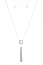 Load image into Gallery viewer, Featuring an opaque shimmer, a glassy pink gem is pressed into a sleek silver frame encrusted in dainty white rhinestones. The glowing pendant gives way to a glistening silver tassel for a whimsical finish. Features an adjustable clasp closure.  Sold as one individual necklace. Includes one pair of matching earrings.
