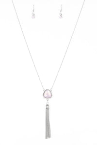 Featuring an opaque shimmer, a glassy pink gem is pressed into a sleek silver frame encrusted in dainty white rhinestones. The glowing pendant gives way to a glistening silver tassel for a whimsical finish. Features an adjustable clasp closure.  Sold as one individual necklace. Includes one pair of matching earrings.