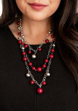 Load image into Gallery viewer, Three silver chains layer down the chest, creating a cascade of shimmer. Beads tinted in a deep red wine hue are mixed with timeless metallic accents that dance along the chains in a colorful statement-making finish. Features an adjustable clasp closure.
