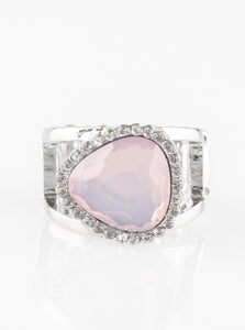 Featuring an opaque shimmer, a glassy pink gem is pressed into a sleek silver frame encrusted in dainty white rhinestones for a whimsical look. Features a stretchy band for a flexible fit.  Sold as one individual ring.