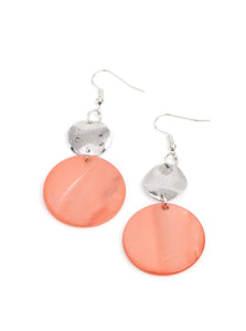 A large pearlescent disc in the spring Pantone® of Burnt Coral is topped by a wavy, sparkling silver disc. The pair sways dramatically from a silver fitting for a breezy finish. Earring attaches to a standard fishhook fitting.