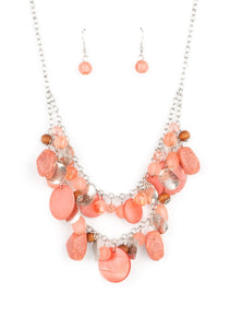 What better way to say "hello spring" than with this vibrant stunner? Double the fun with two layers of beads, baubles, stone, and wood in varying tones and finishes in the Pantone® of Burnt Coral, intermixed with sparkling, wavy silver discs gently swaying from a silver chain. Features an adjustable clasp closure.