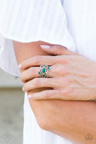 Featuring smooth and serrated surfaces, shimmery silver bars crisscross across the finger, coalescing into an airy band. Faceted Quetzal Green beads are sprinkled across the bands for a colorful finish. Features a stretchy band for a flexible fit.  Sold as one individual ring.   Glimpses of Malibu Fashion Fix September 2018  Always nickel and lead free.