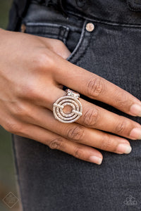Pinched between two shiny silver fittings, shimmery textured hoops radiate into a dizzying frame atop the finger. Features a stretchy band for a flexible fit.   Glimpses of Malibu Fashion Fix  December 2018  Always nickel and lead free.