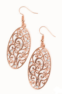 Vine-like filigree climbs a shiny copper oval frame. Dainty white rhinestones are sprinkled across the airy pattern, adding glassy splashes of shimmer to the whimsical palette. Earring attaches to a standard fishhook fitting.  Sold as one pair of earrings.