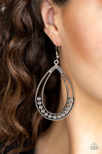 Glittery hematite rhinestones collect at the bottom of an ornate silver teardrop for an edgy look. Earring attaches to a standard fishhook fitting.  Sold as one pair of earrings.  Always nickel and lead free.