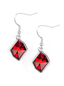A faceted red gem is pressed into an abstract silver frame for a refined look. Earring attaches to a standard fishhook fitting.  Sold as one pair of earrings.  
