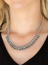 Load image into Gallery viewer, A fringe of glittery hematite rhinestones swings from the bottom of a bold silver chain below the collar for a fierce look. Features an adjustable clasp closure.  Sold as one individual necklace. Includes one pair of matching earrings.  