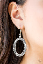 Load image into Gallery viewer, Encrusted in two rows of glittery hematite rhinestones, a shimmery silver oval hoop swings from the ear in a glamorous fashion. Earring attaches to a standard fishhook fitting.  Sold as one pair of earrings.   Always nickel and lead free.