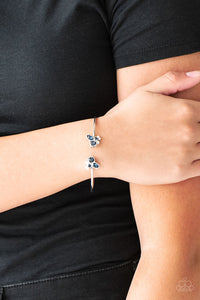 Varying in shape, glittery blue and white rhinestones join at both ends of a dainty silver cuff, creating refined fittings.  Sold as one individual bracelet.  Always nickel and lead free.