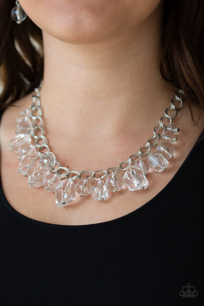 Varying in shape and shimmer, smooth and faceted glassy beads trickle from doubled silver chain links, creating a glamorous fringe below the collar. Features an adjustable clasp closure.  Sold as one individual necklace. Includes one pair of matching earrings.  Always nickel and lead free.