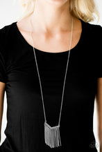 Load image into Gallery viewer, Encrusted in glittery hematite rhinestones, a V-shaped frame gives way to silver fringe. Infused with an elongated silver chain, the tapered fringe adds flirty movement to the piece, while elegantly lengthening the torso. Features an adjustable clasp closure.  Includes one pair of matching earrings.