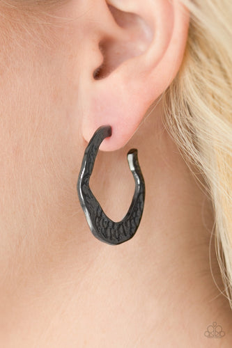 Delicately hammered in shimmery textures, a glistening ribbon of gunmetal curls into an edgy, asymmetrical hoop. Earring attaches to a standard post fitting. Hoop measures 1” in diameter.  Sold as one pair of hoop earrings.  ﻿Always nickel and lead free!