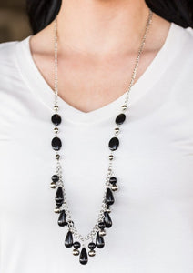 An array of black beads trickles down a shimmery silver chain for a whimsical look. Shiny silver beads are sprinkled between the colorful accents, adding classic shimmer to the seasonal palette. Features an adjustable clasp closure.  Sold as one individual necklace. Includes one pair of matching earrings.