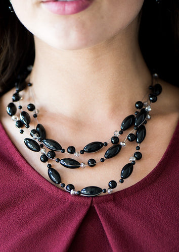 Varying in size and shimmer, polished and crystal-like beading is threaded along rows of shimmery wires, creating floating layers below the collar. Features an adjustable clasp closure.  Sold as one individual necklace. Includes one pair of matching earrings.
