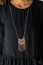 Load image into Gallery viewer, Radiating in linear textures, a glistening copper crescent swings from the bottom of a lengthened copper chain. Shimmery copper chains and flared copper beading swings from the bottom of the tribal inspired pendant, creating a flirtatious fringe. Features an adjustable clasp closure.   Sold as one individual necklace. Includes one pair of matching earrings.  Always nickel and lead free.
