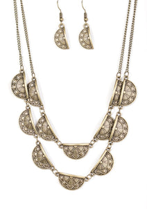 Embossed in feminine floral vintage details, shimmery brass frames link below the collar in two glistening rows for a simply seasonal look. Features an adjustable clasp closure.  Sold as one individual necklace. Includes one pair of matching earrings.
