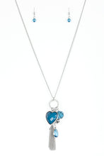 Load image into Gallery viewer, Infused with a lengthened silver chain, an array of glassy blue and shimmery silver accents swing from the bottom of a white rhinestone encrusted frame. A faceted blue heart frame swings from the bottom of the sparkling frame, adding a romantic finish to the whimsical tassel. Features an adjustable clasp closure.  Sold as one individual necklace. Includes one pair of matching earrings.