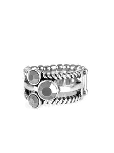 A trio of glittery hematite rhinestones are sprinkled along smooth and twisted silver bands, creating edgy layers across the finger. Features a stretchy band for a flexible fit.  Sold as one individual ring.  Always nickel and lead free.