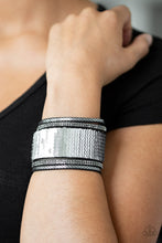 Load image into Gallery viewer, Infused with strands of smoky hematite rhinestones and dainty metallic accents, row after row of shimmery sequins are stitched across the front of a spliced black suede band. Bracelet features reversible sequins that change from silver to silver. Features an adjustable snap closure.  Sold as one individual bracelet.  Always nickel and lead free.