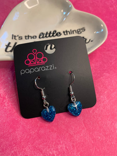 Darling sparkling hearts gracefully fall from the ear.  Earring attaches to a standard fishhook fitting.  Sold as one pair of earrings.  Always nickel and lead free.