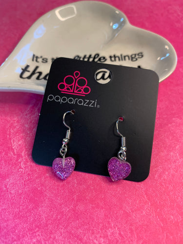Darling sparkling hearts gracefully fall from the ear.  Earring attaches to a standard fishhook fitting.  Sold as one pair of earrings.  Always nickel and lead free.