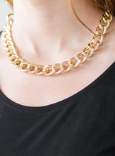 Load image into Gallery viewer, Brushed in a high-sheen shimmer, a bold gold chain drapes below the collar in an edgy industrial fashion. Features an adjustable clasp closure.  Sold as one individual necklace. Includes one pair of matching earrings.