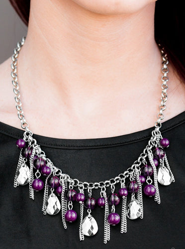 Polished and translucent purple beads trickle from the bottom of a bold silver chain for a splash of color. Infused with strands of silver chain, faceted silver teardrops drip from the purple beading, creating a fierce fringe below collar. Features an adjustable clasp closure.  Sold as one individual necklace. Includes one pair of matching earrings.