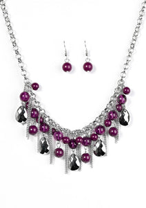 Polished and translucent purple beads trickle from the bottom of a bold silver chain for a splash of color. Infused with strands of silver chain, faceted silver teardrops drip from the purple beading, creating a fierce fringe below collar. Features an adjustable clasp closure.  Sold as one individual necklace. Includes one pair of matching earrings.