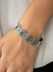 Featuring smoky emerald-cut rhinestone centers, ornate silver frames are threaded along stretchy bands around the wrist for a refined fashion.  Sold as one individual bracelet.  