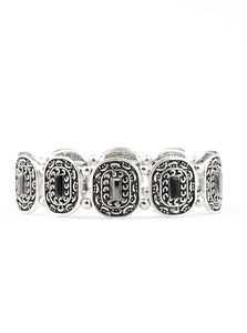 Featuring smoky emerald-cut rhinestone centers, ornate silver frames are threaded along stretchy bands around the wrist for a refined fashion.  Sold as one individual bracelet.