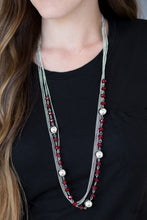Load image into Gallery viewer, Infused with rows of shimmery silver chains, a strand of glittery red crystal-like beads and classic silver accents drape across the chest for a regal finish. Features an adjustable clasp closure.  Sold as one individual necklace. Includes one pair of matching earrings.