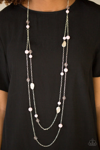 Featuring faceted silver accents, glassy and polished pink beads trickle along strands of shimmery silver chains for a seasonal look. Features an adjustable clasp closure.  Sold as one individual necklace. Includes one pair of matching earrings.  Always nickel and lead free.