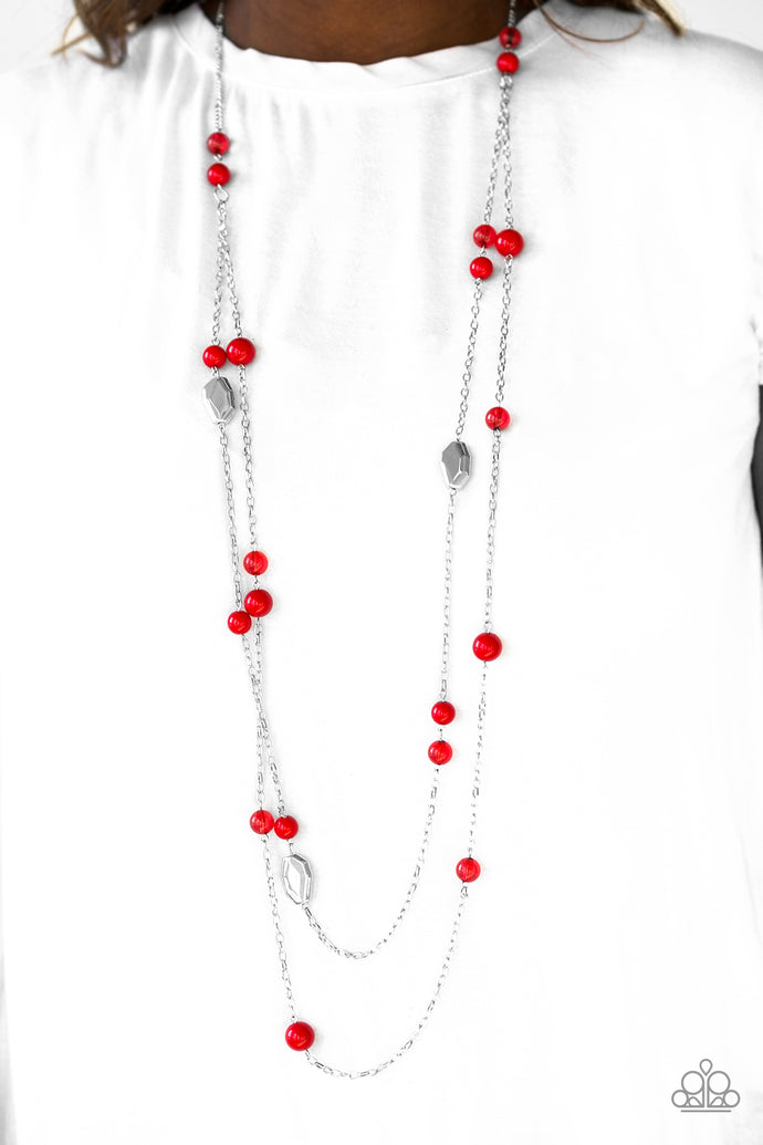 Featuring faceted silver accents, glassy and polished red beads trickle along strands of shimmery silver chains for a seasonal look. Features an adjustable clasp closure.  ﻿Sold as one individual necklace. Includes one pair of matching earrings.  Always nickel and lead free.