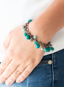 Pearly and polished green beading joins faceted gunmetal beads along a bold gunmetal chain, creating a sassy fringe around the wrist. Features an adjustable clasp closure.  Sold as one individual bracelet.