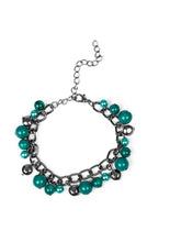 Load image into Gallery viewer, Pearly and polished green beading joins faceted gunmetal beads along a bold gunmetal chain, creating a sassy fringe around the wrist. Features an adjustable clasp closure. Sold as one individual bracelet.