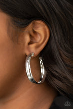Load image into Gallery viewer, Etched in a shimmery linear pattern, a thick silver hoop curls around the ear for some classic edge. Earring attaches to a standard post fitting. Hoop measures approximately 2&quot; in diameter.  Sold as one pair of hoop earrings.  Always nickel and lead free.