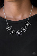 Load image into Gallery viewer, Dotted with radiant white rhinestone centers, airy silver flowers link below the collar for a seasonal look. Features an adjustable clasp closure.  Sold as one individual necklace. Includes one pair of matching earrings.  Always nickel and lead free.
