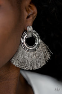 A plume of shiny gray thread flares out from the bottom of an ornate silver fitting, creating a fierce fringe. Earring attaches to a standard post fitting.  Sold as one pair of post earrings.  Always nickel and lead free.