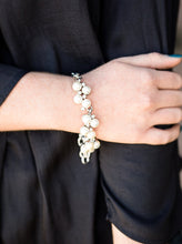 Load image into Gallery viewer, Small clusters of shimmery white pearls are dusted with sparkling rhinestones, creating a romantic timeless design. Features an adjustable clasp closure.  Sold as one individual bracelet.