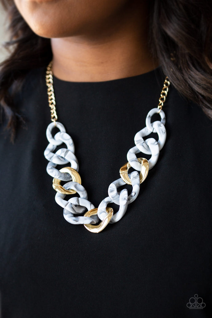 Featuring a faux marble finish, smoky white acrylic links connect with shiny metallic links below the collar for a colorful statement-making look. Features an adjustable clasp closure.  Sold as one individual necklace. Includes one pair of matching earrings.  Always nickel and lead free.