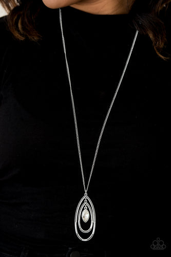 Dotted in sections of studded textures, three glistening silver teardrops swing from the bottom of an elongated silver chain. Featuring a regal marquise style cut, a glittery white gem is pressed into the centermost frame for a glamorous finish. Features an adjustable clasp closure.  Sold as one individual necklace. Includes one pair of matching earrings.  Always nickel and lead free.